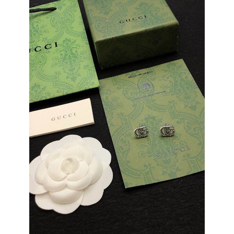 G*u*i earrings